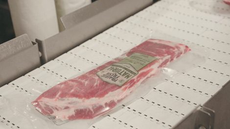 image of Prairie Fresh package of pork on conveyor belt at Seaboard Triumph Foods processing plant