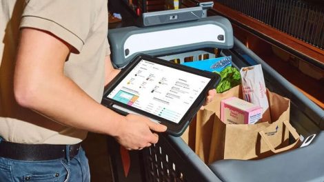 image of customer using a smart cart at a grocery store