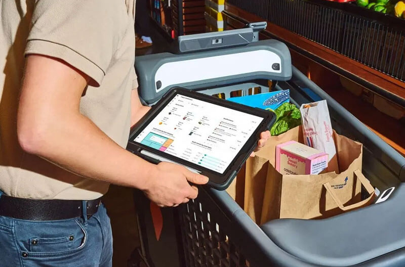 image of customer using a smart cart at a grocery store