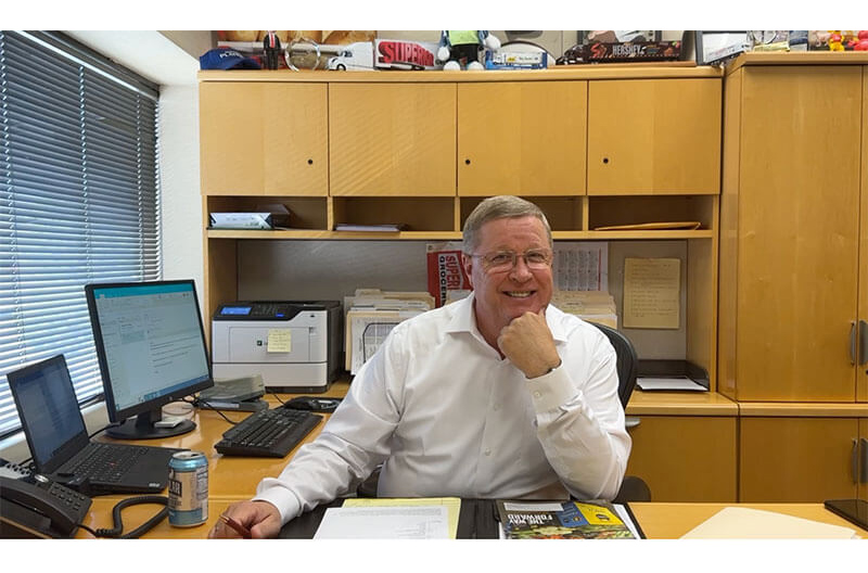 Richard Wardwell sitting at his desk