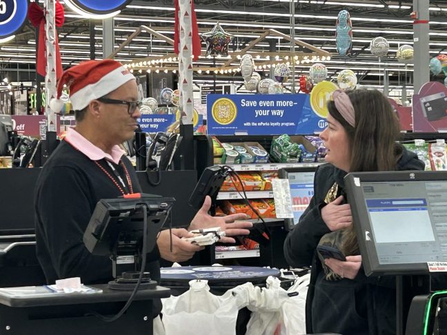 Meijer Very Merry employee surprising a customer during checkout