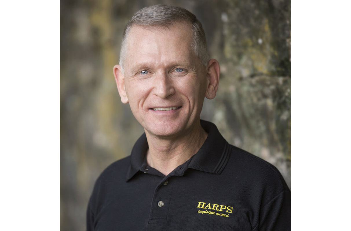 headshot image of Kim Eskew with Harps Food Stores