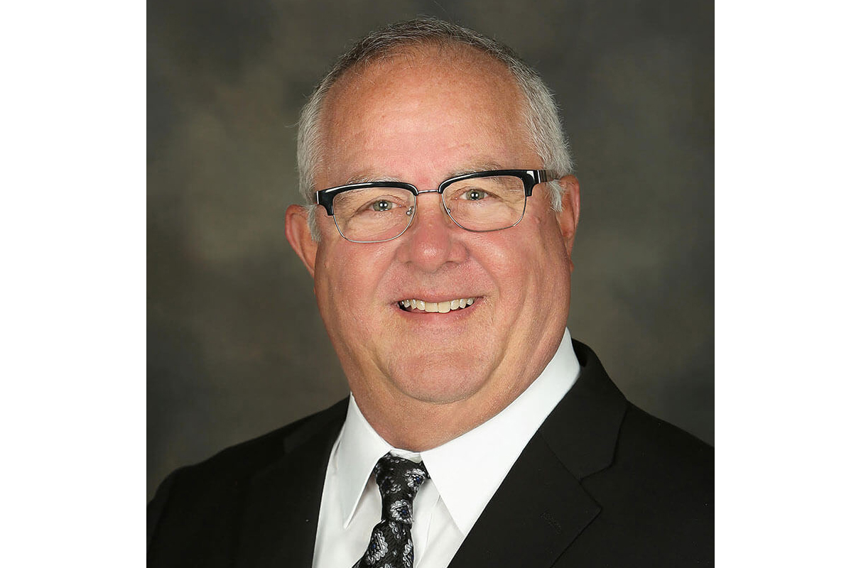 headshot of John Dyste with North Dakota Grocers Association