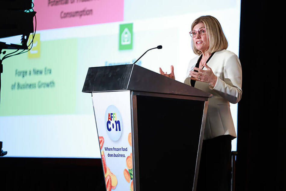 photo of Alison Bodor, president and CEO of AFFI, standing at podium