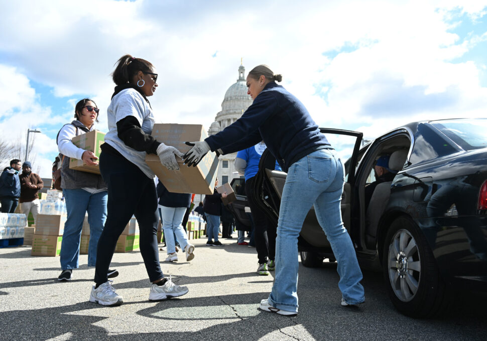 Price Rite Marketplace and Feed the Children load a car with free food and supplies