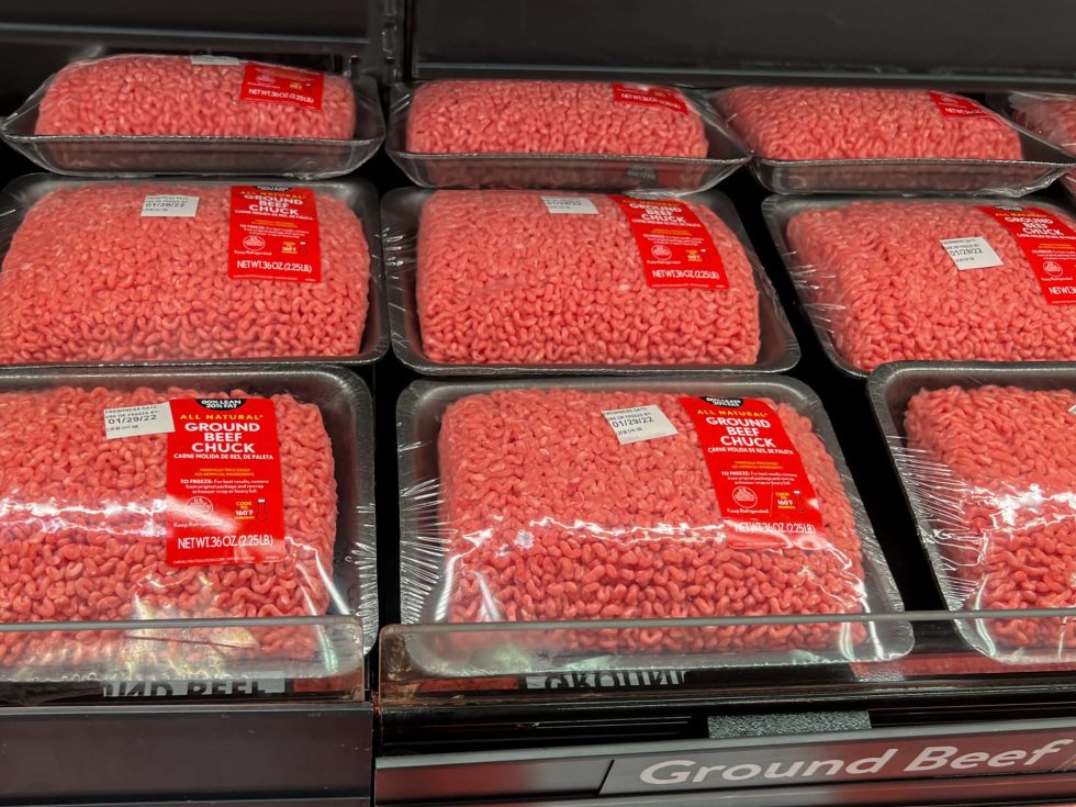 photo of ground beef packages in meat case at grocery store