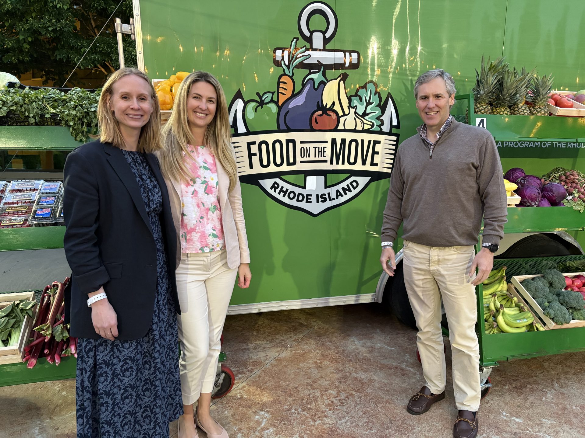 UNFI leaders Alisha Real, Kristine Creveling and Matt Echols visit the Rhode Island Public Health Institute’s Food on the Move mobile market at the 13th Annual UNFI Charity Classic.