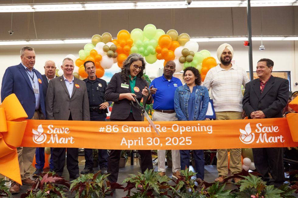 Save Mart Modesto Store Manager Holly Alton cuts the ribbon at the store’s Grand Reopening event on Wednesday, April 30, 2025 (L to R: John Norman, Vice President Central Operations, The Save Mart Companies; Donovan Ford, Chief Operating Officer, The Save Mart Companies; Jim Perkins, President, The Save Mart Companies; Sean Dodge, Community Resource Officer, Modesto Police Department; Holly Alton, Store Manager; Jeremiah Williams, Modesto City Council, D5; Danielle Mogart, Field Representative for Assembly Member Juan Alanis, 22nd District; Mani Grewal, County Supervisor, D4; Richard O’Neal, District Manager, Save Mart D7. Photo credit: Alfonso Rojas, Rojas Photography