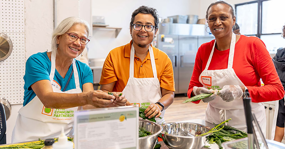 image of three people in Sprouts Community Foundation sponsored cooking class
