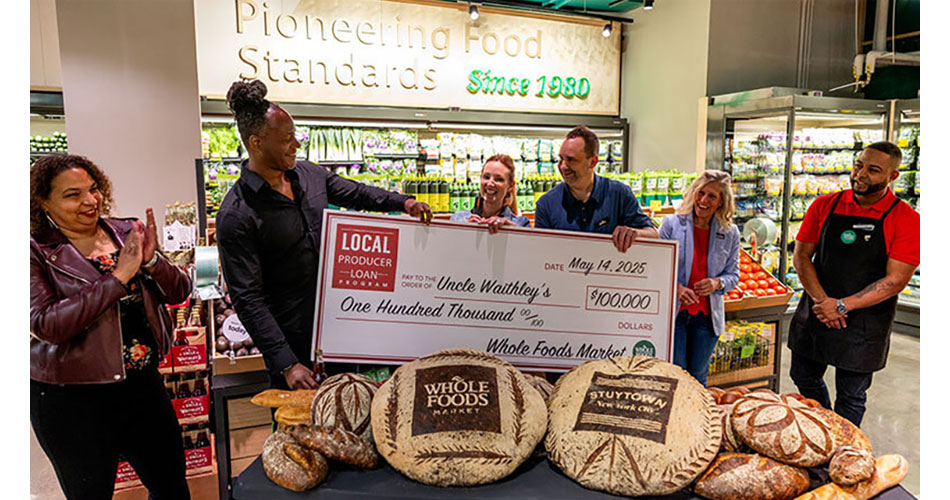 image of check presentation during grand opening of Whole Foods Market Daily Shop in NYC