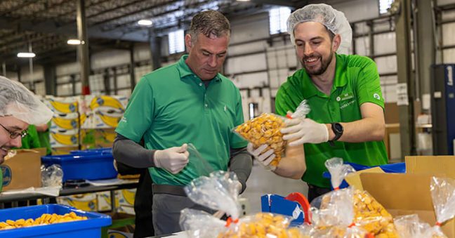 photo of Publix CEO Kevin Murphy and associates working at Manna Food Bank in Western NC
