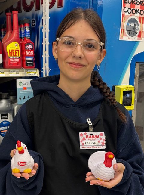 photo of Babbs Supermarket employee holding foam chicken and turkey