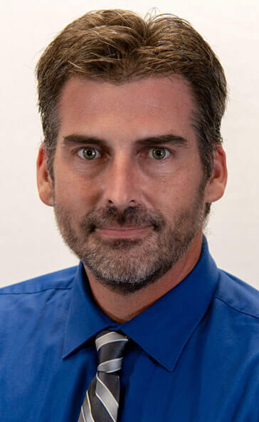headshot of Greg Hinkley, manager of Mackinaw Family Market