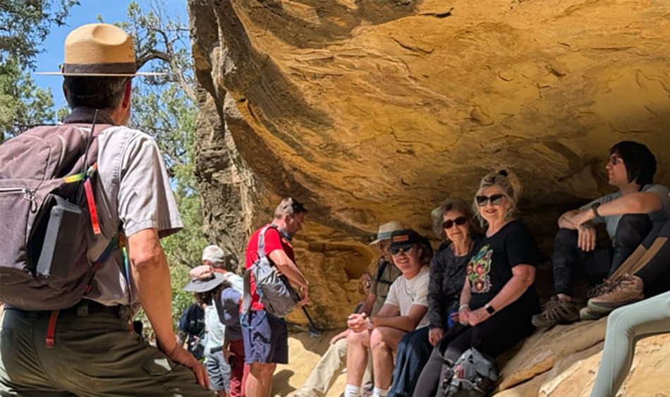 photo of national parks tour guide with group of tourists