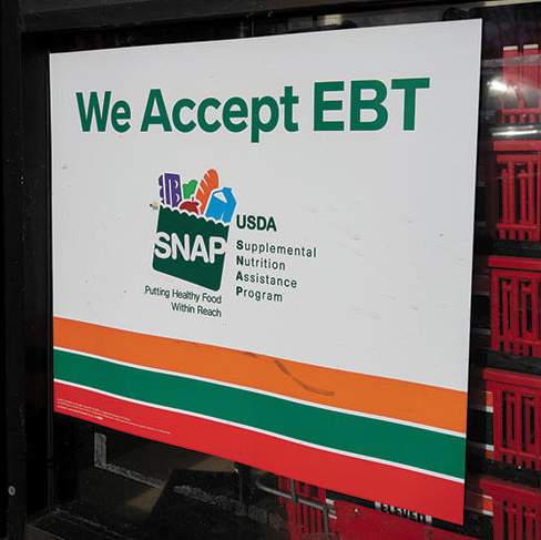 image of SNAP EBT sign in grocery store window