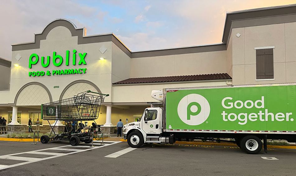 image of exterior of new Ft. Myers Publix store with large shopping cart and Good Together truck out front
