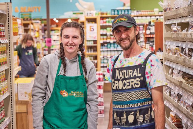 photo of Natural Grocers employees standing store aisle