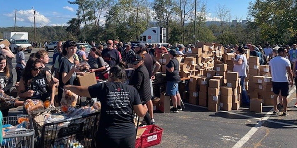photo of crowd at food drive in Earth Fare parking lot in Asheville following Hurricane Helene