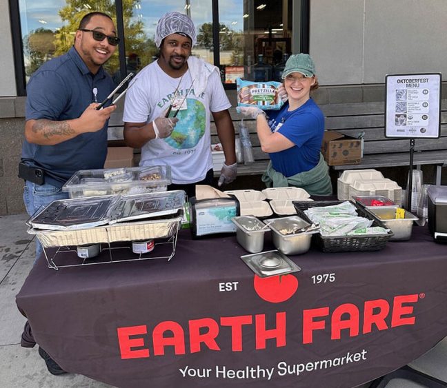 photo of Earth Fare employees at table during Oktoberfest event