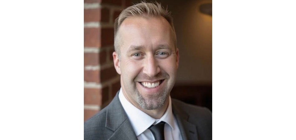 headshot of Wakefern VP Travis Riepenhoff