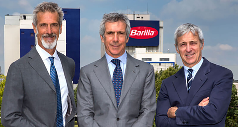 photo of Guido, Paolo and Luca Barilla with Barilla logo seen in background