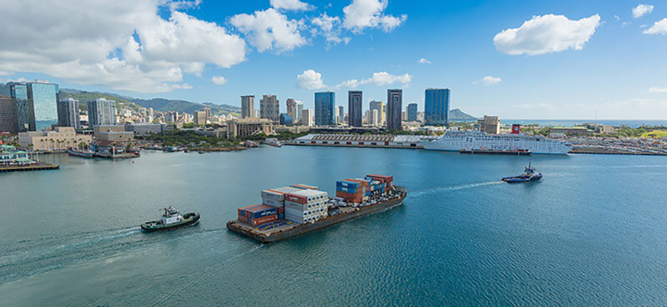 photo of boats and barges coming into a port in Hawaii