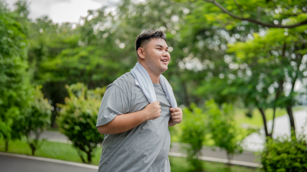 man jogging to improve health and wellness