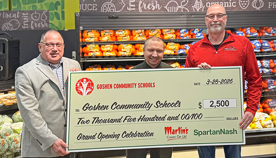 photo of Martin's officials presenting check to local school offiicial in Goshen, Indiana