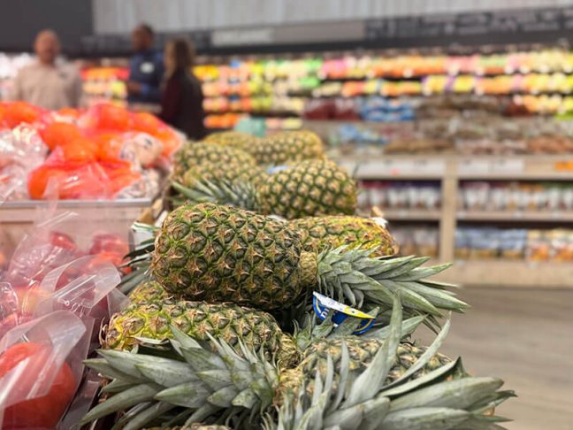 Harrison Family Fare produce department with pineapple display in foreground