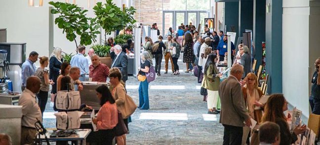 photo of crowd in lobby of event center at a previous National Rural Grocery Summit