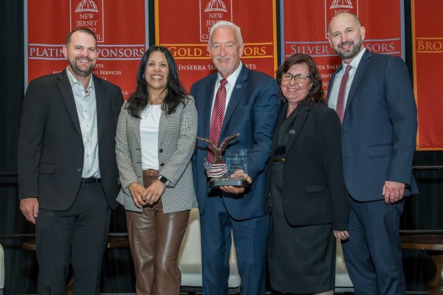 The Associated Supermarket Group’s team celebrate Ken Scher (center), the 2026 JimmyOstling Trade Relations Award Honoree.