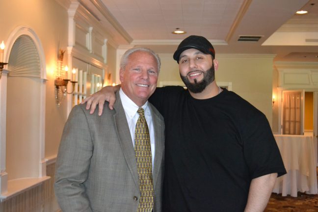 Joseph Fantozzi, Allegiance Retail Services President and COO, with coop member Shady Widdi.