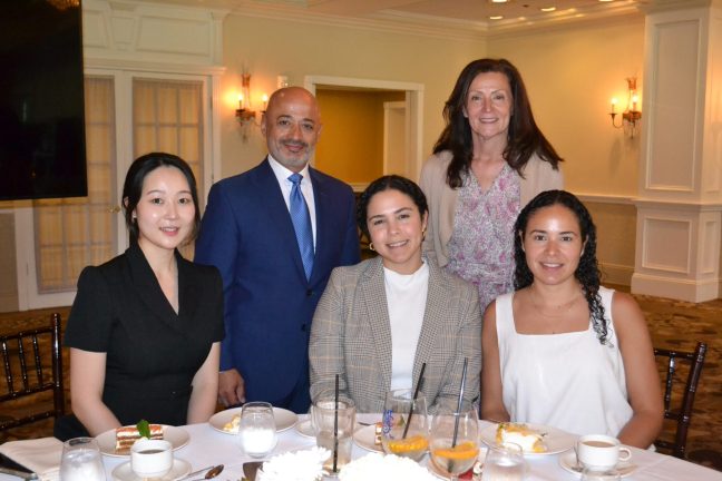 Samer Rahman, EVP & Chief Merchandising Officer and Donna Zambo, EVP & Chief Marketing Officer stand behind Allegiance coop members Alisa Sun, Carolina Collado and Iliana Collado.