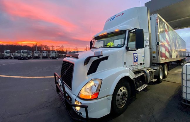 photo of Food City truck with sunset in background