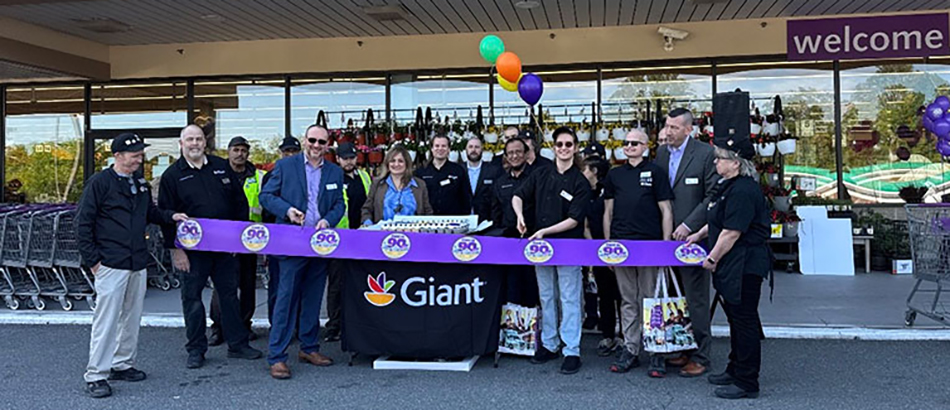 photo of group of people cutting ribbon for Giant Food grand re-opening