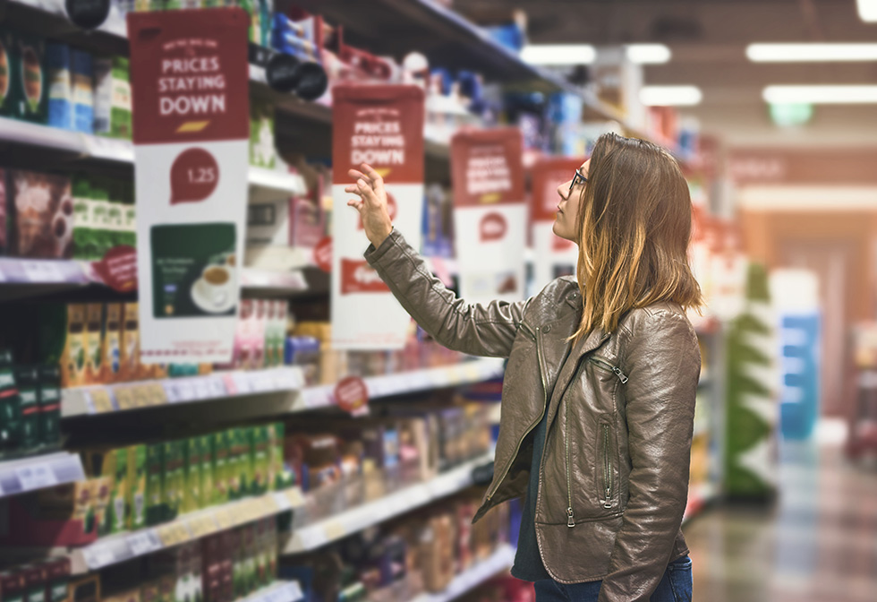 Adobe Stock grocery shopper making a decision in store
