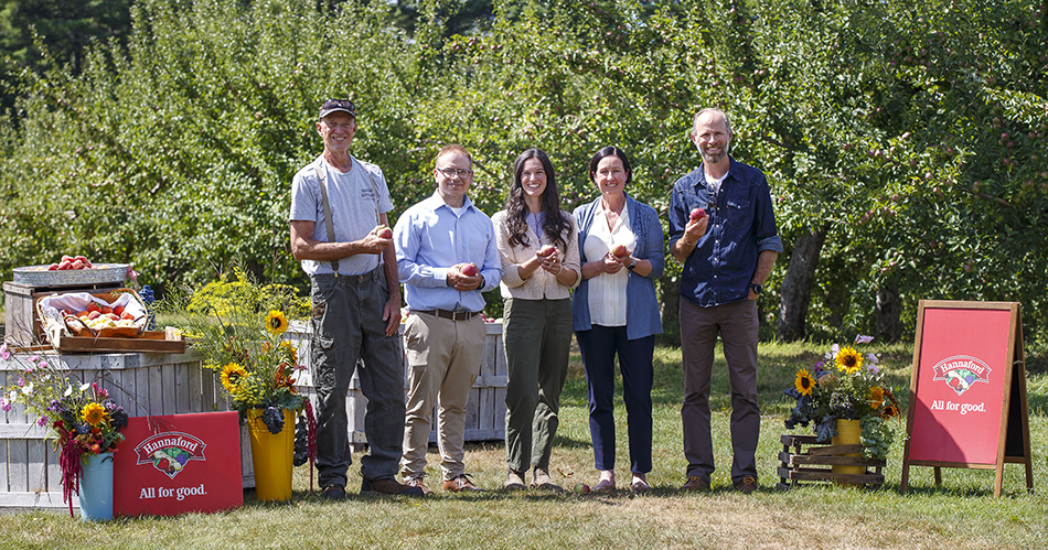 photo of group from Hannaford Supermarkets and other organizations standing in apple orchard
