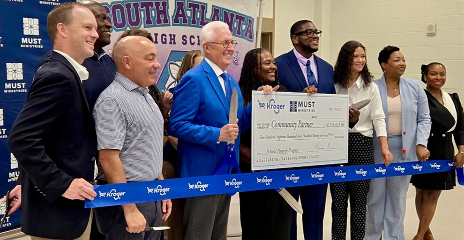 photo of group cutting ribbon at Kroger-sponsored food pantry at South Atlanta High School