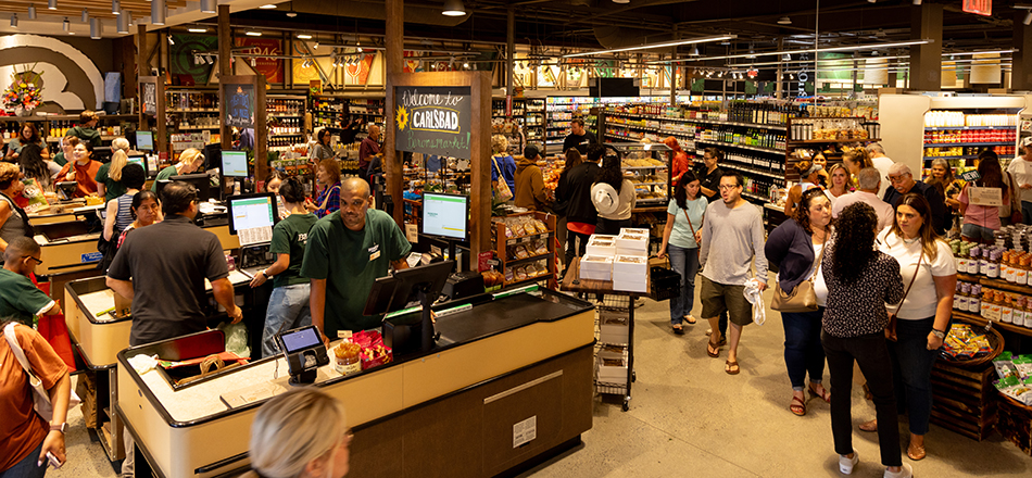 photo of customers at registers at Barons Market new store in Carlsbad