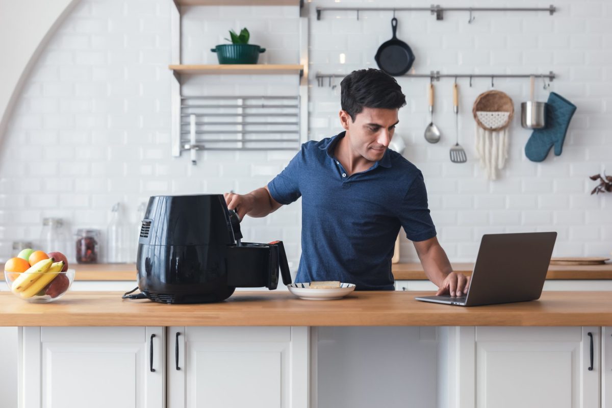man using air fryer