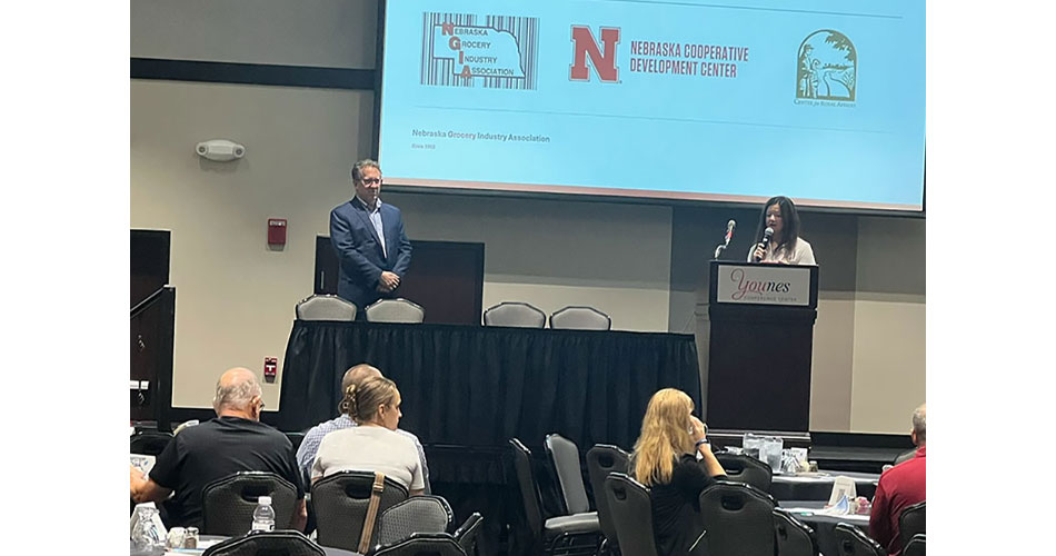 NGIA Executive Director Ansley Fellers, right, introduces Congressman Adrian Smith at the fourth annual Nebraska Grocery Industry Summit.