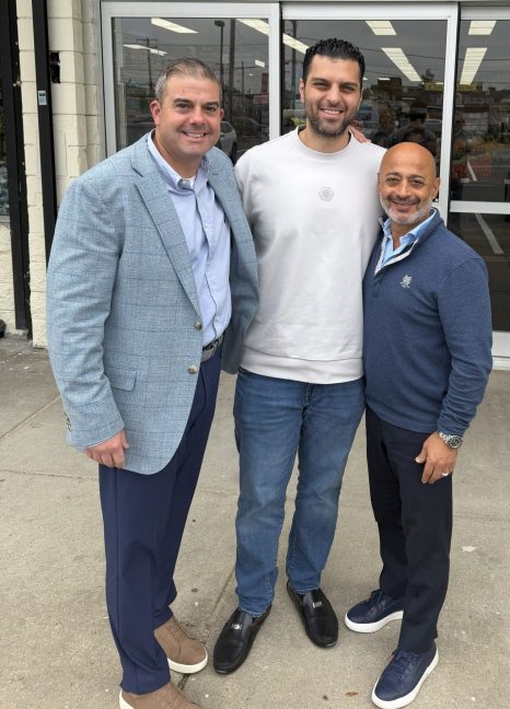 three men at store opening